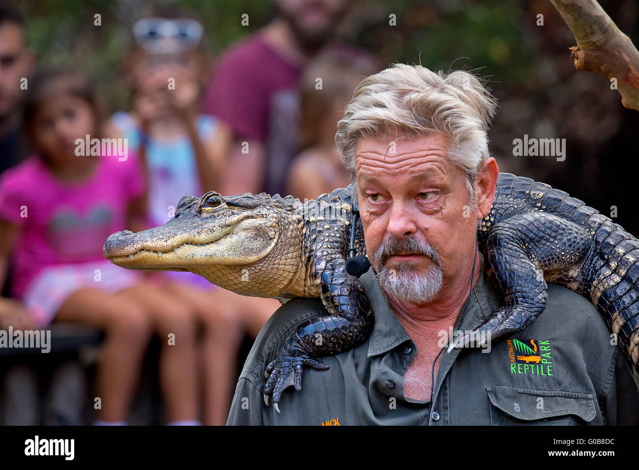 An educator gives a talk to visitors to the Australian Reptile Park