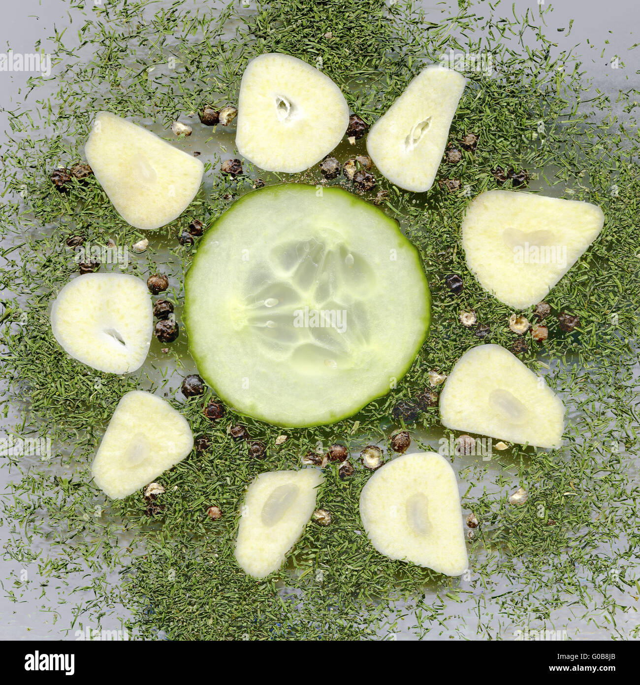 cucumber slice and garlic cloves with dried dill Stock Photo