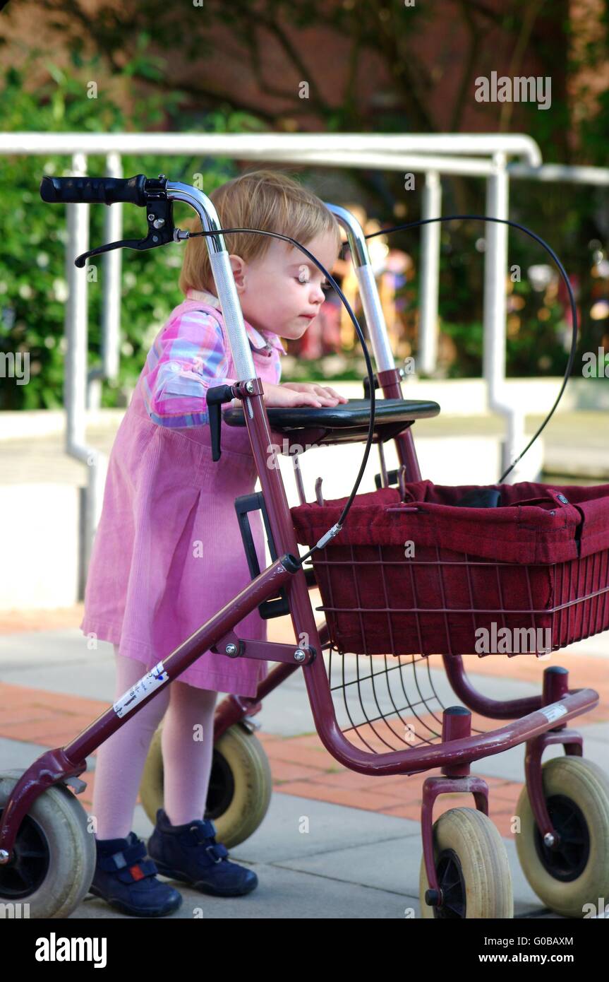 Child plays with a Rollator Stock Photo