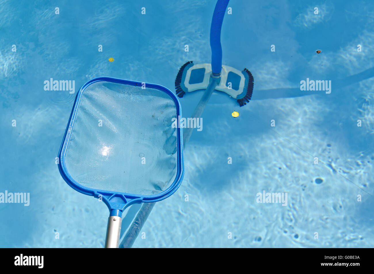 swimming basin with dip net and a vacuum cleaner Stock Photo