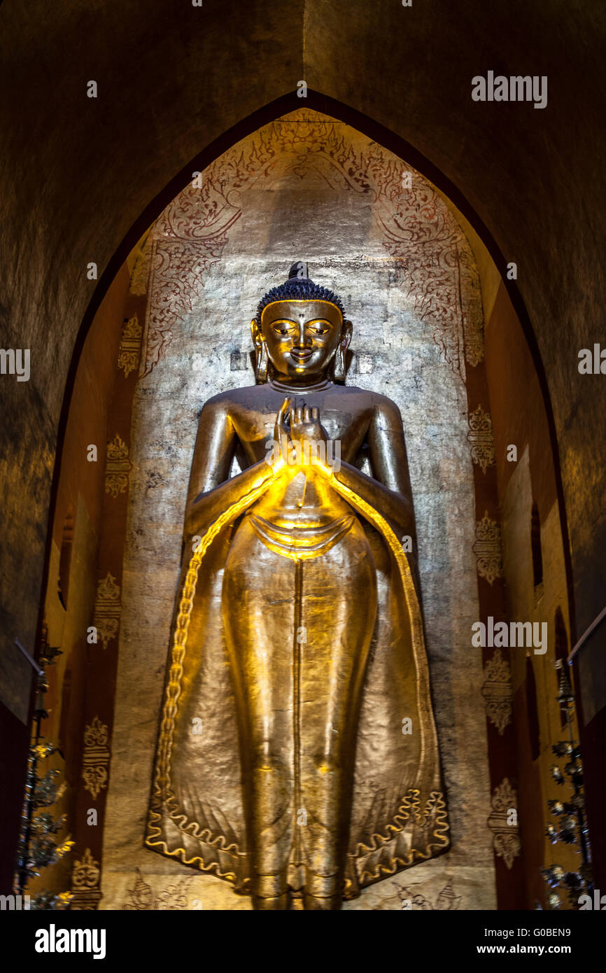 The South facing Buddha (30 ft in height), also known as standing Buddha Kassapa, at the Ananda temple in Old Bagan (Myanmar). Stock Photo
