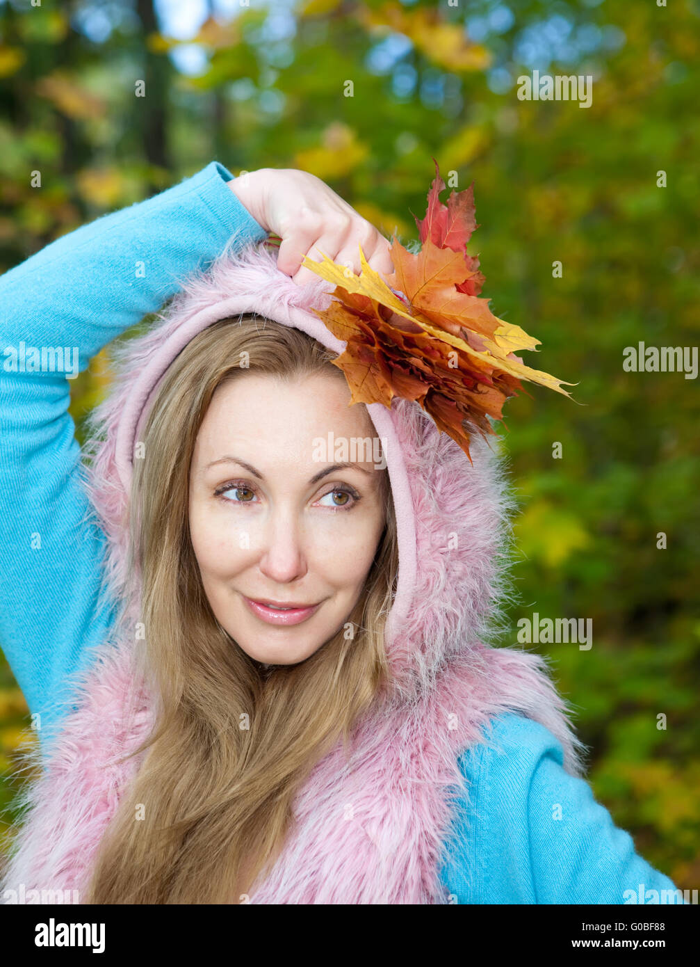 beautiful woman in autumn park with maple leaves Stock Photo - Alamy