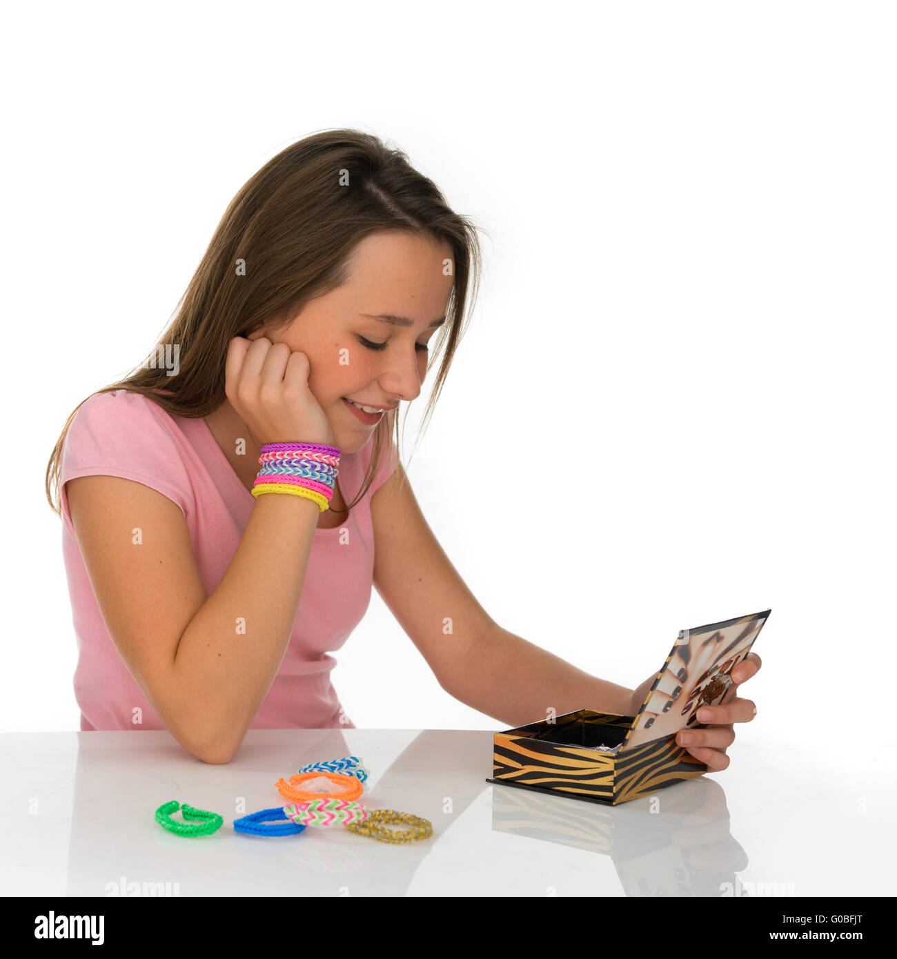 Young girl deciding what jewellery to wear Stock Photo