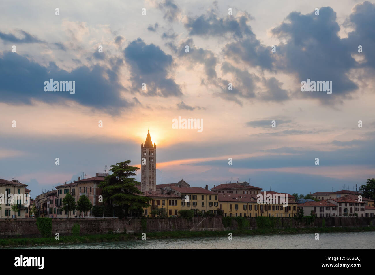 Verona at the Adige river at sunset Stock Photo - Alamy
