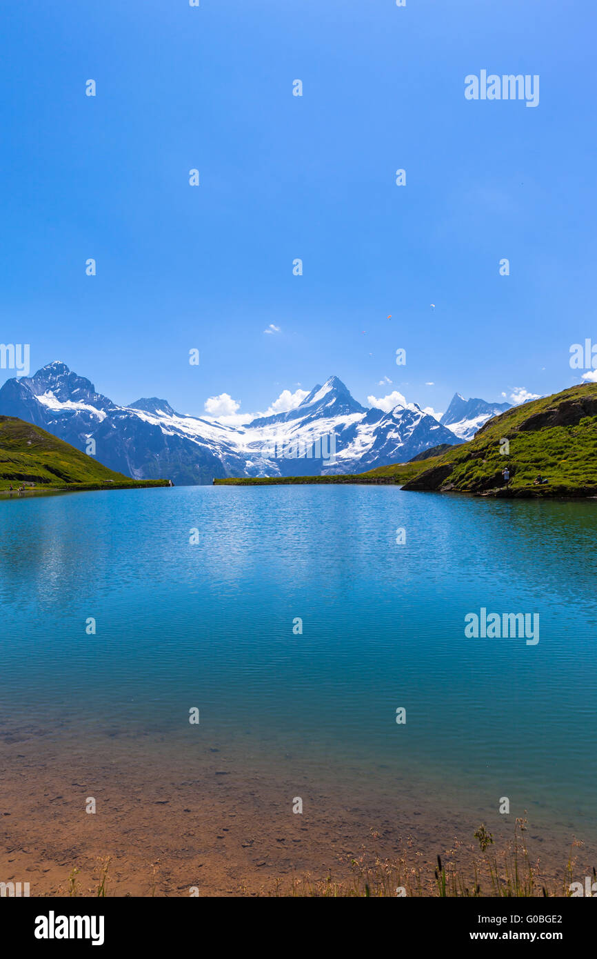 Stunning view of Bachalpsee and the snow coverd peaks with glacier of swiss alps, on Bernese Oberland, Switzerland. Stock Photo