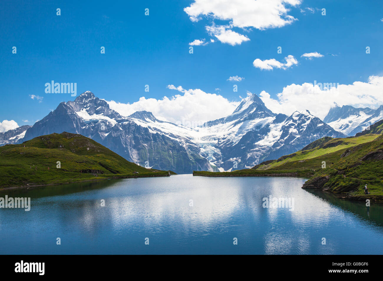 Panorama view of Bachalpsee and the snow coverd peaks with glacier of swiss alps Stock Photo