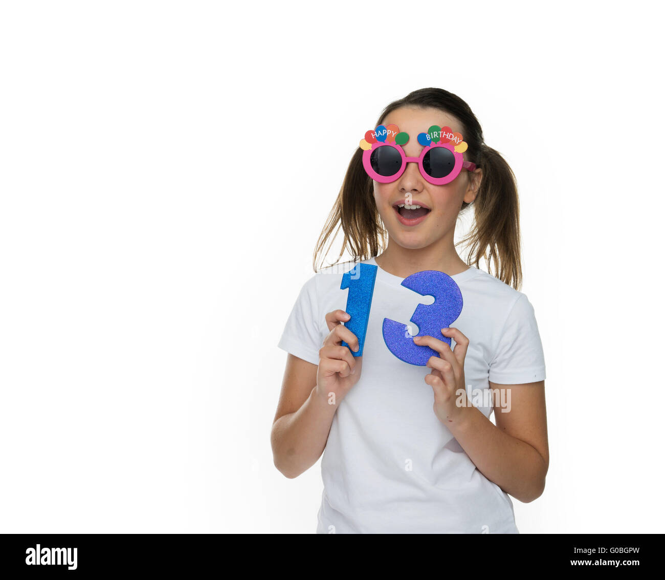 Happy young girl celebrating being a teenager Stock Photo