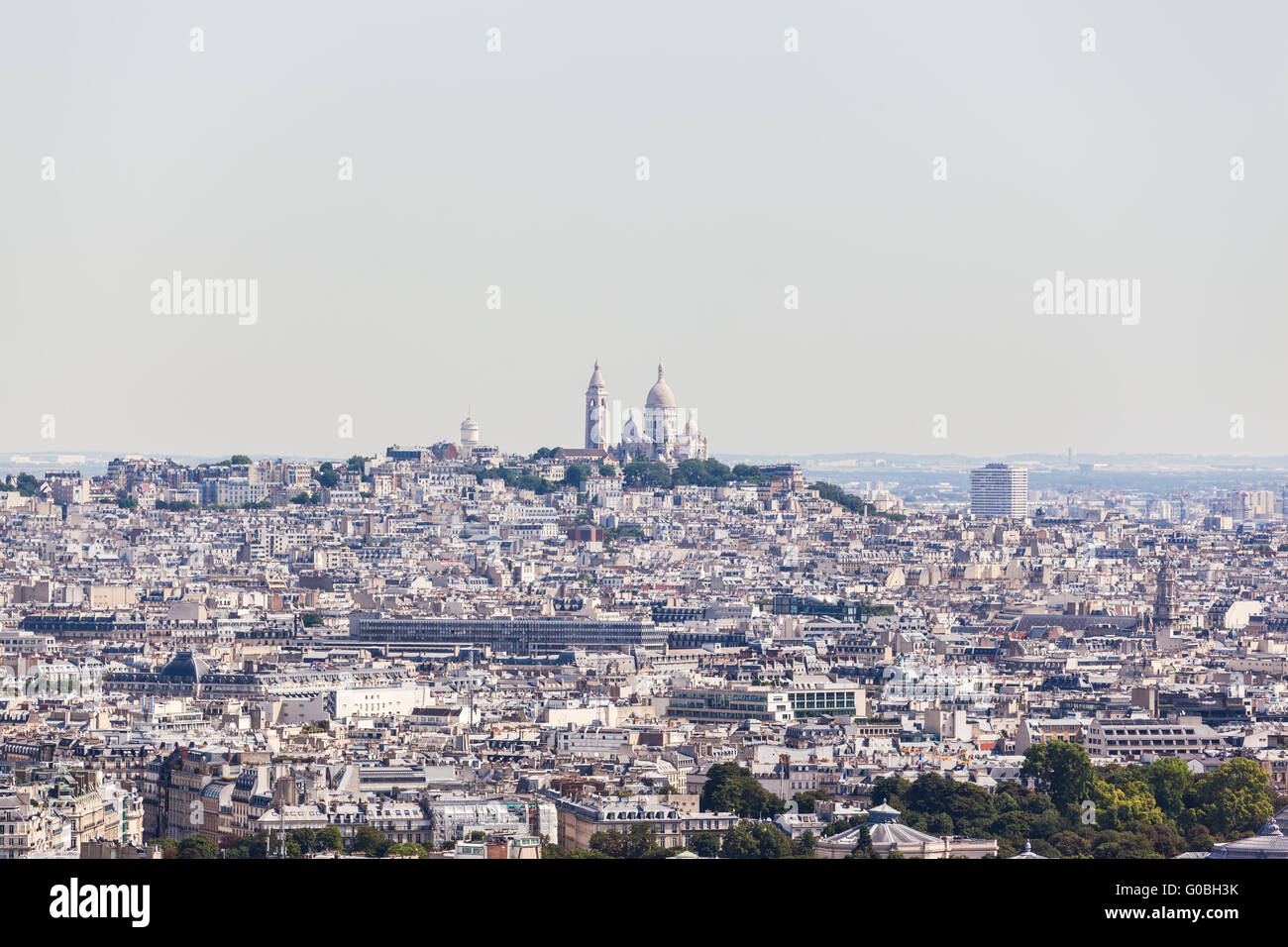 View of Cityscape of Paris in direction of Basilica of the Sacred Heart on the summit of the butte Montmartre from Eiffel tower, Stock Photo