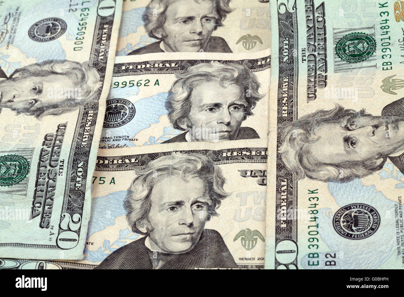 five 20 dollar bills arranged vertically and horizontally Stock Photo