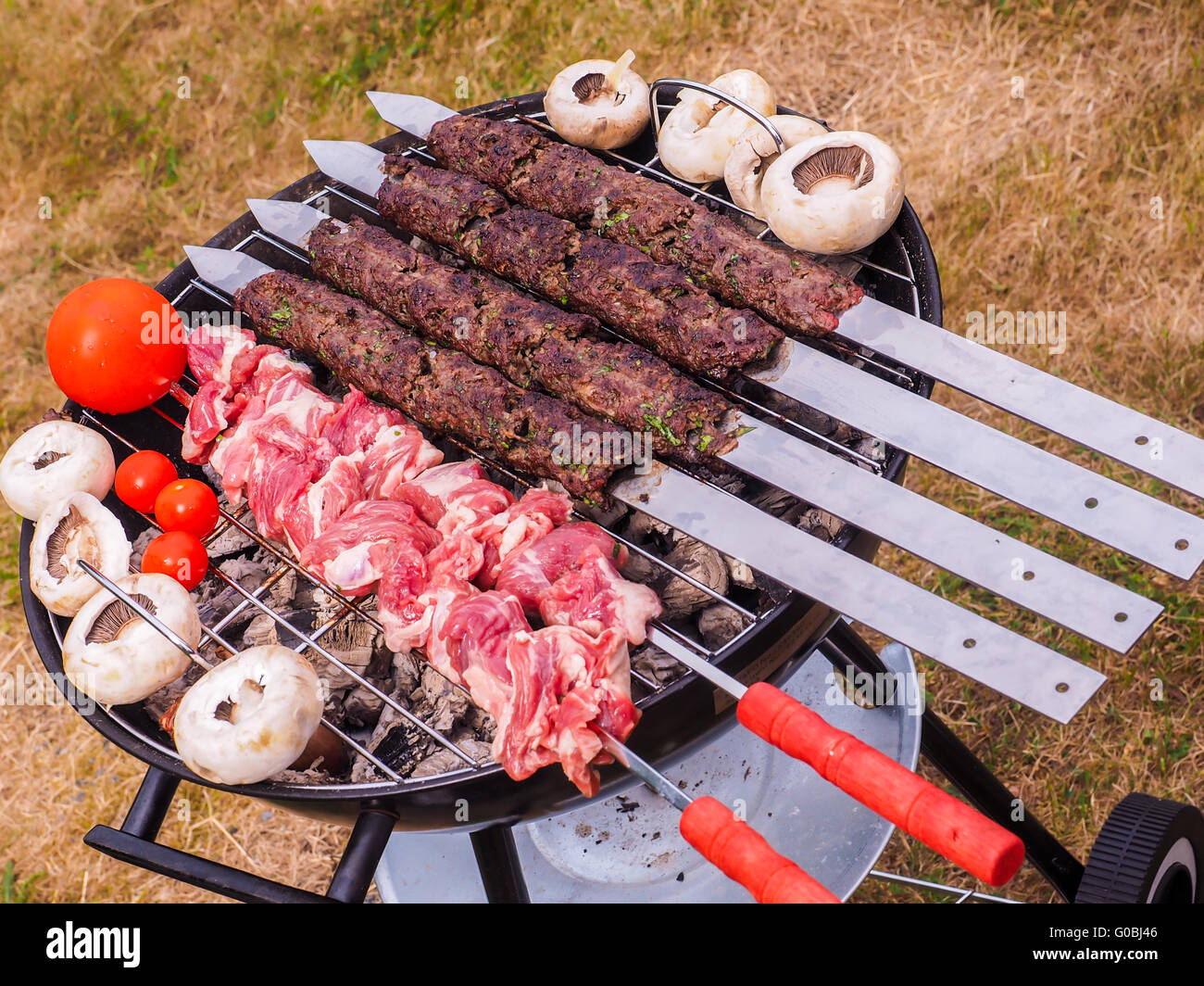Kebab skewers on barbecue Stock Photo Alamy