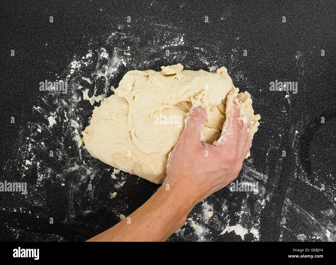 Hands kneading dough Stock Photo - Alamy