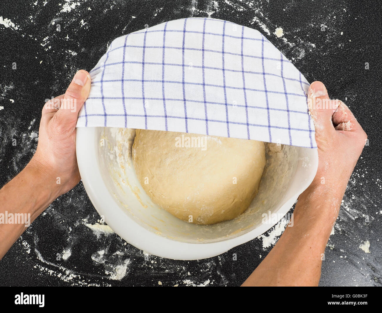 Proofing dough under towel Stock Photo Alamy