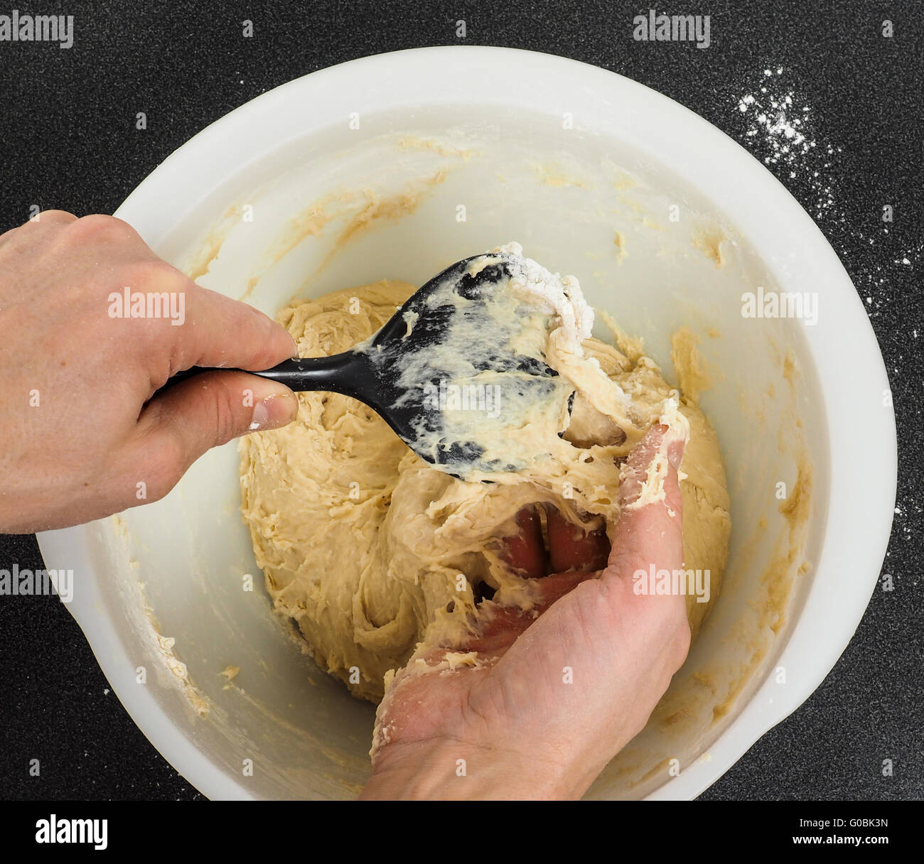 Handling sticky dough Stock Photo