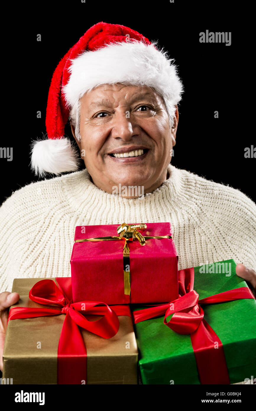 Aged Man Offering Three Wrapped Christmas Presents Stock Photo
