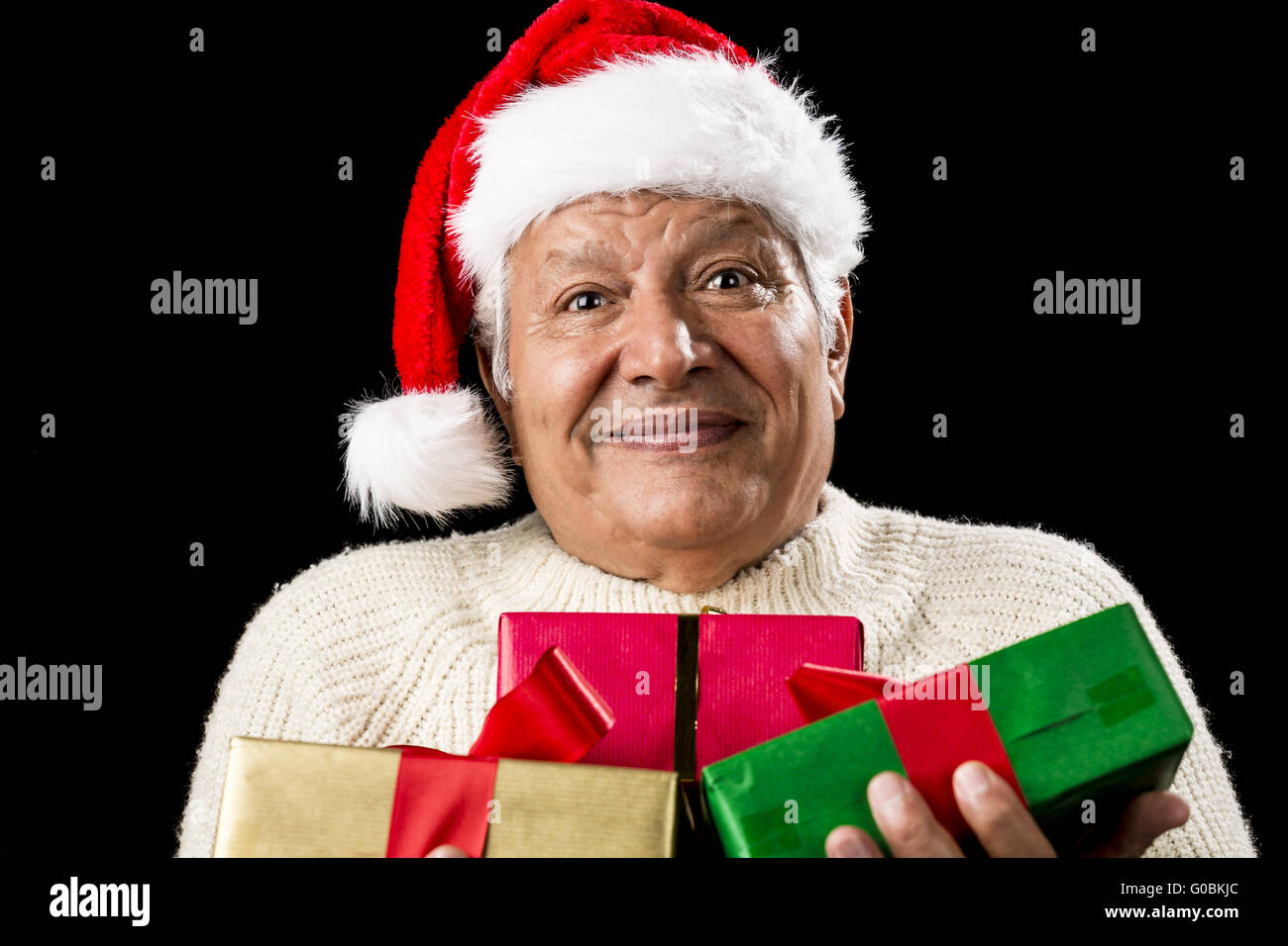 Puzzled Old Gentleman Carrying Three Wrapped Gifts Stock Photo