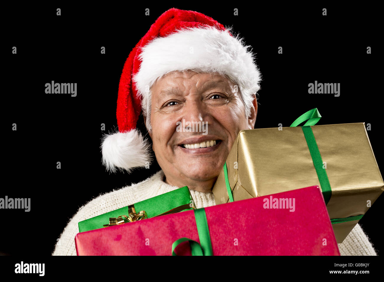 Jolly Old Man With Santa Cap And Three Xmas Gifts Stock Photo