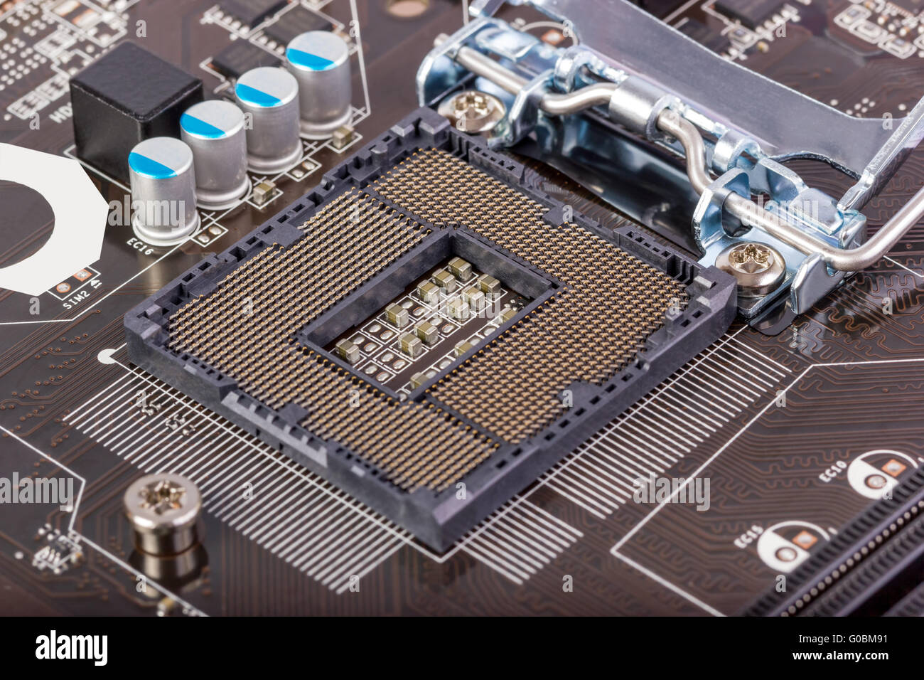 Empty CPU processor socket with pins on motherboar Stock Photo