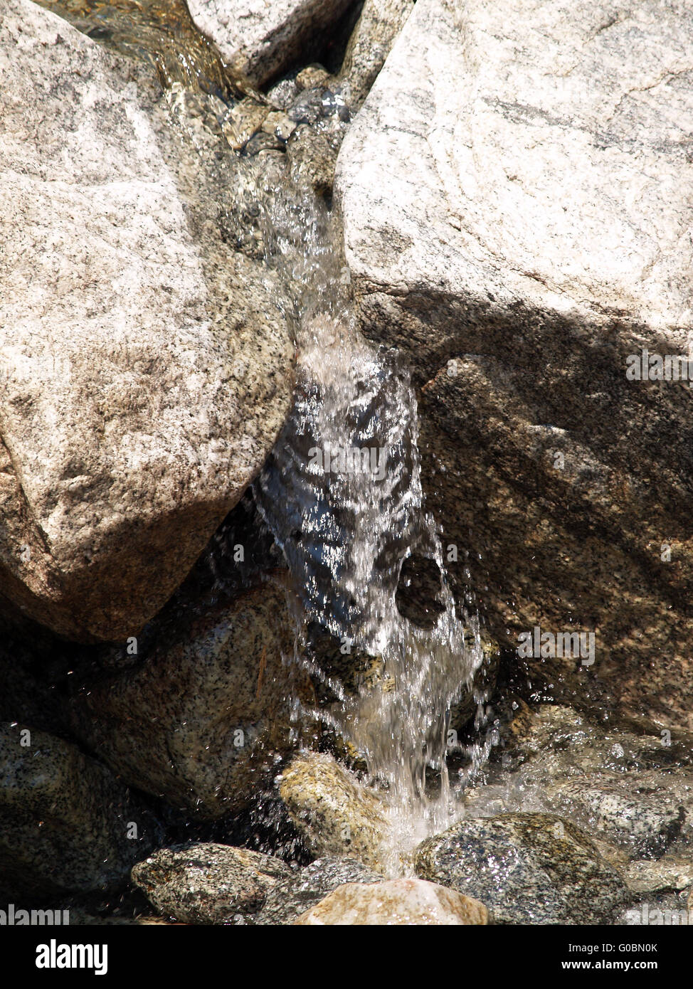 Water stream flowing between rocks hi-res stock photography and images ...