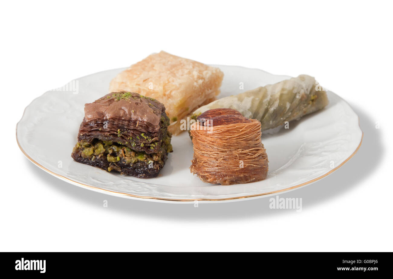 Plate with various turkish baklava isolated over white background Stock Photo