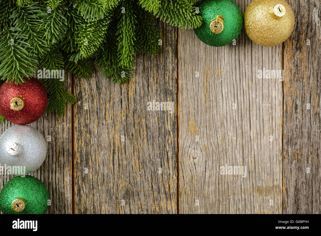 Christmas Pine Needle and Ornaments on a Rustic Wood Background Stock ...