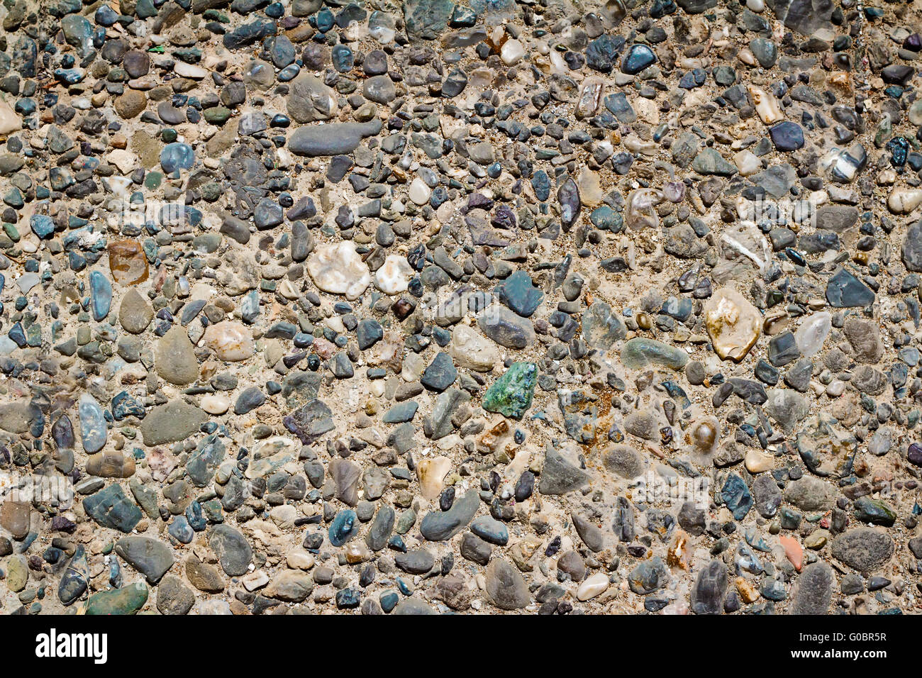 The fragment of the wall of small stones ( the bac Stock Photo