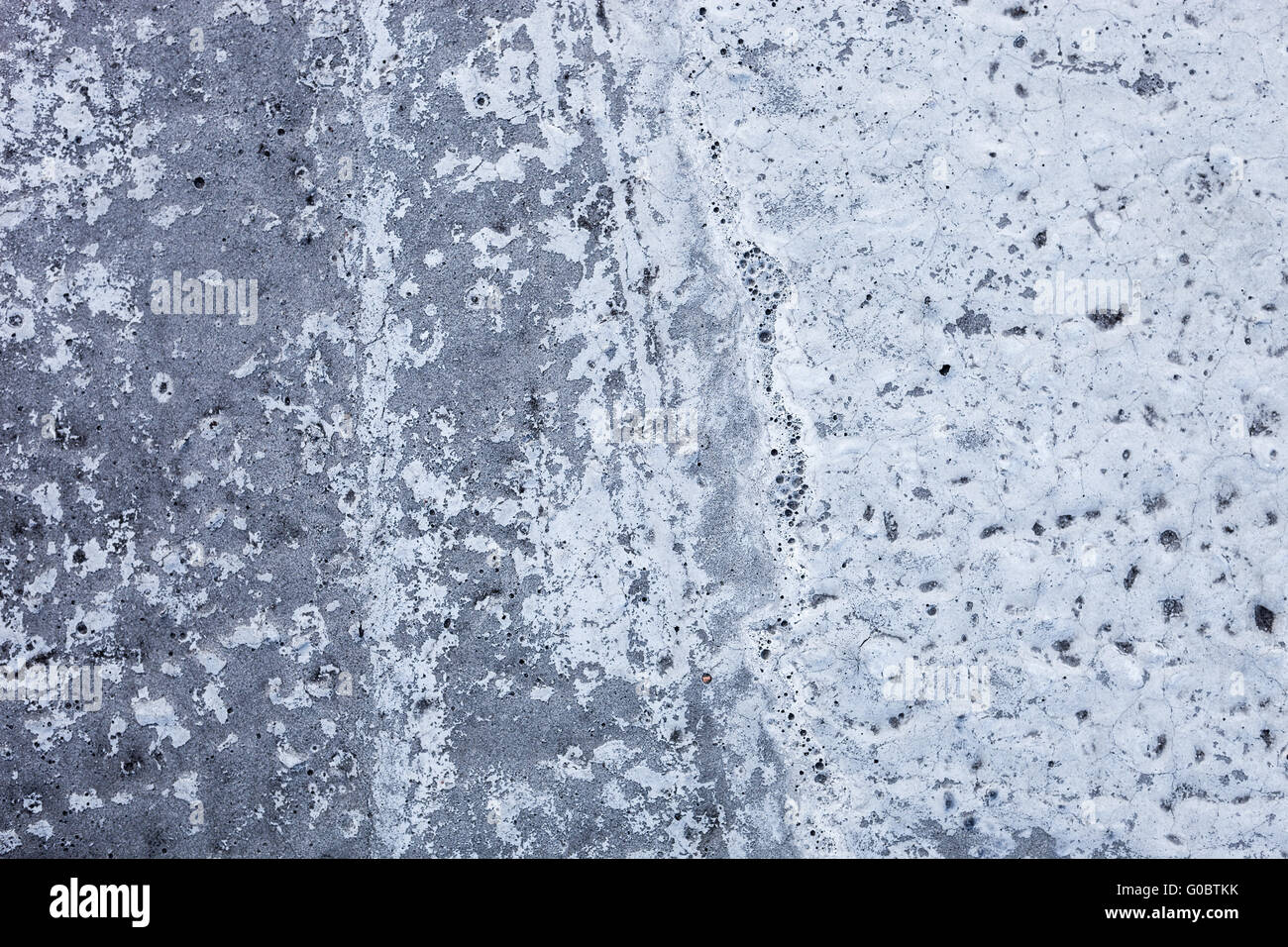 Partly whitewashed concrete wall with rich and various texture Stock Photo