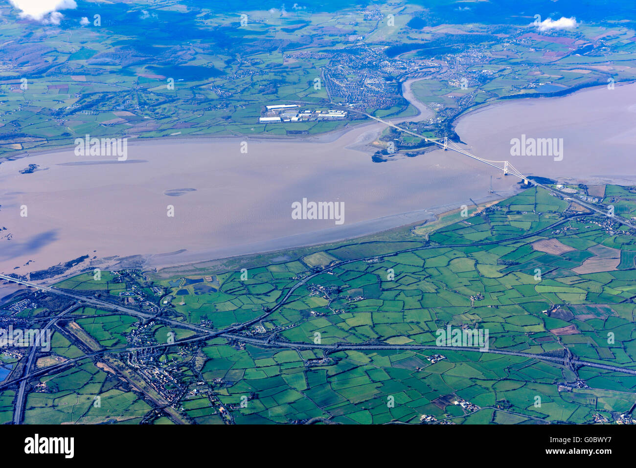 Aerial view River Severn Estuary with old Severn road bridges, between England and Wales and patchwork of agricultural fields Stock Photo