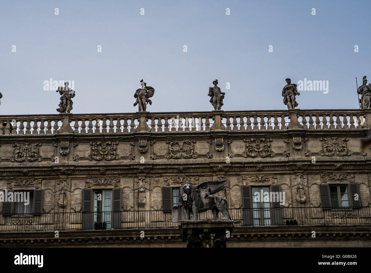 Human Statue on Top of Architectural Old Building Stock Photo