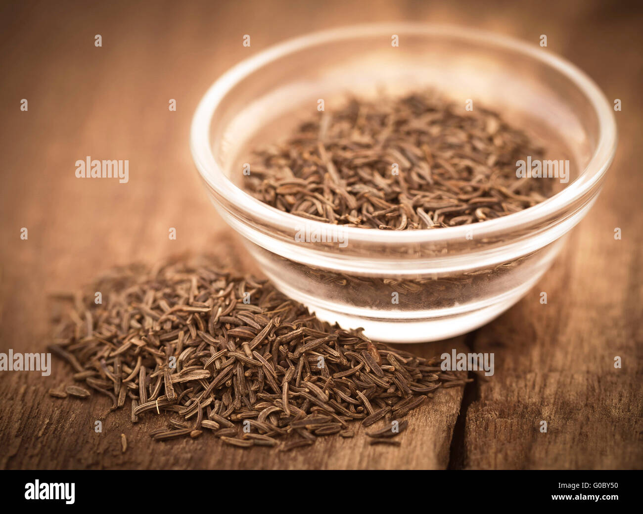Caraway seeds in a glass bowl Stock Photo