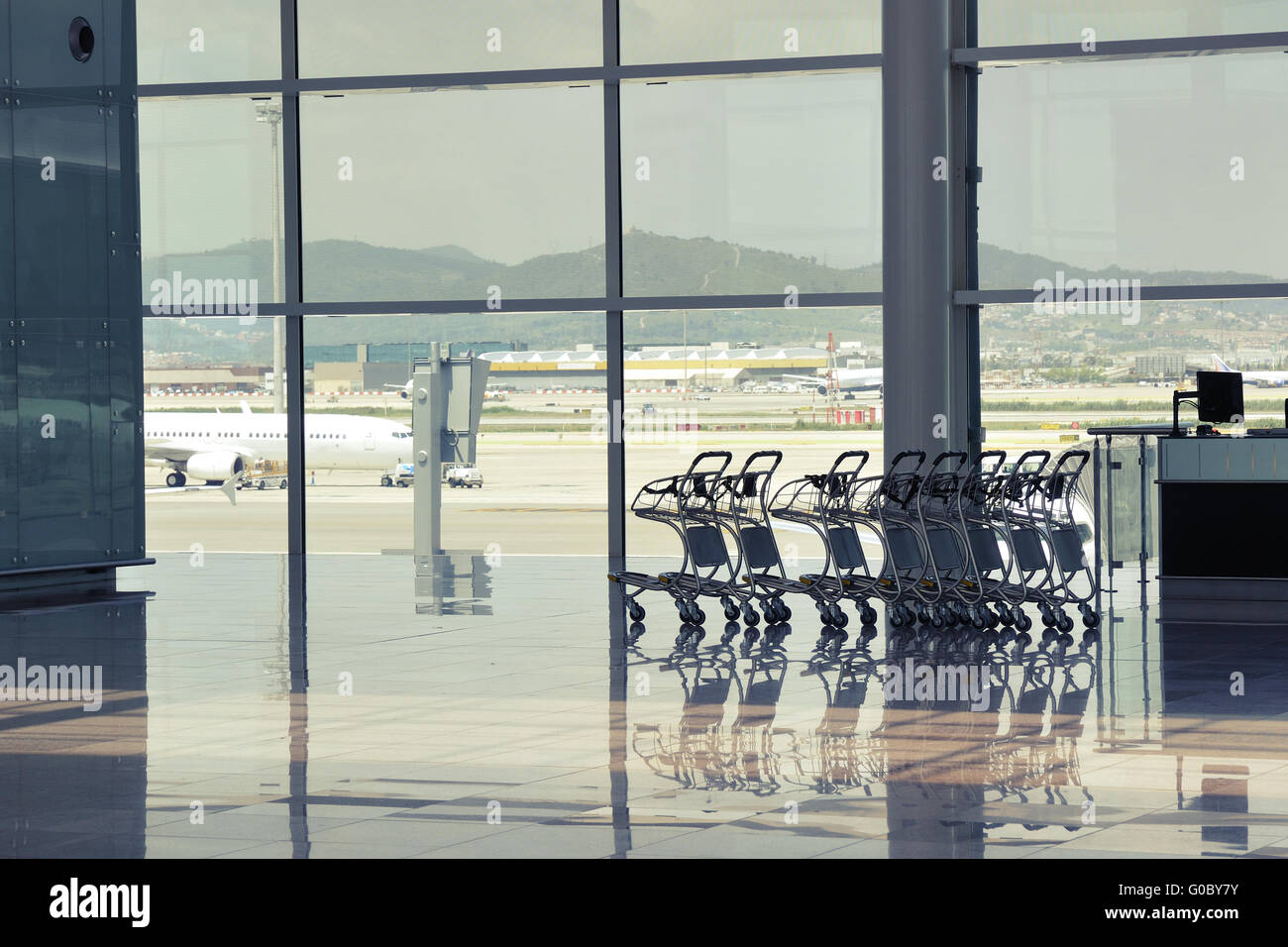 waiting hall of El Prat airport in Barcelona with empty luggage