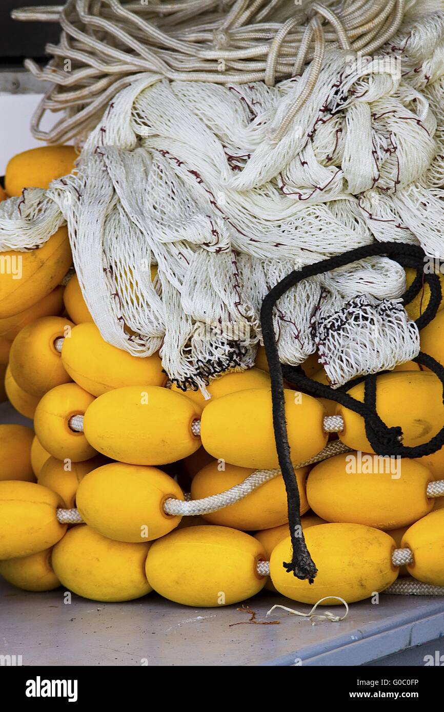 fishing nets on the vessel rolled Stock Photo - Alamy