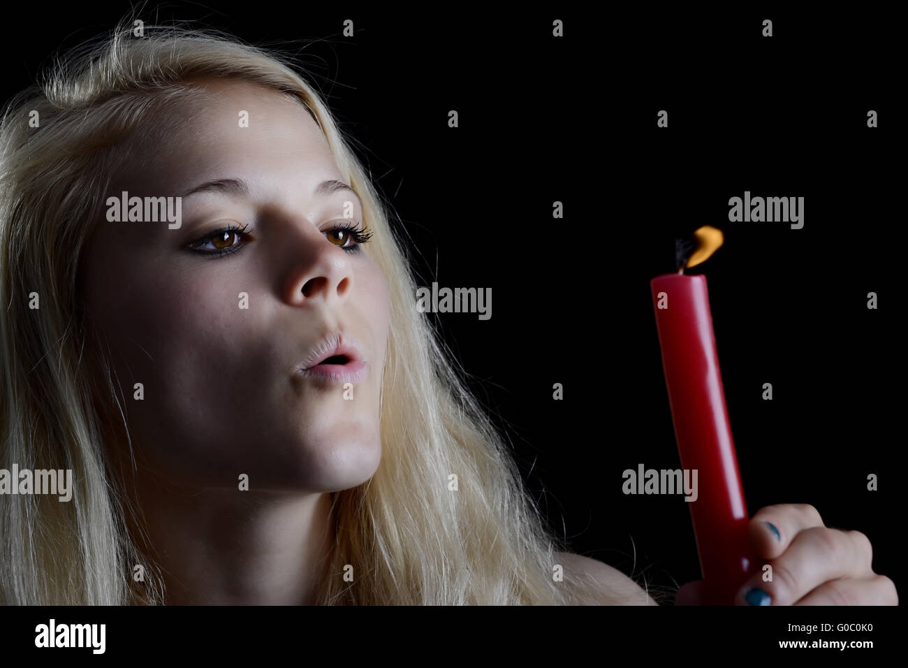 woman blowing candle Stock Photo Alamy