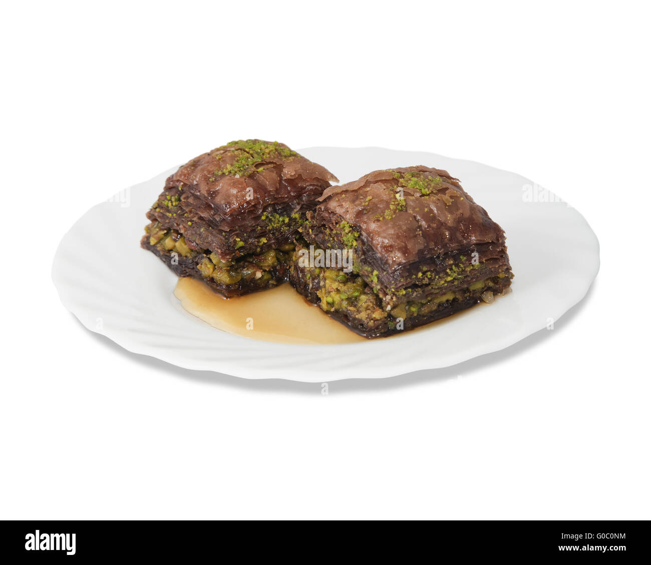 Plate with turkish baklava isolated over white background Stock Photo