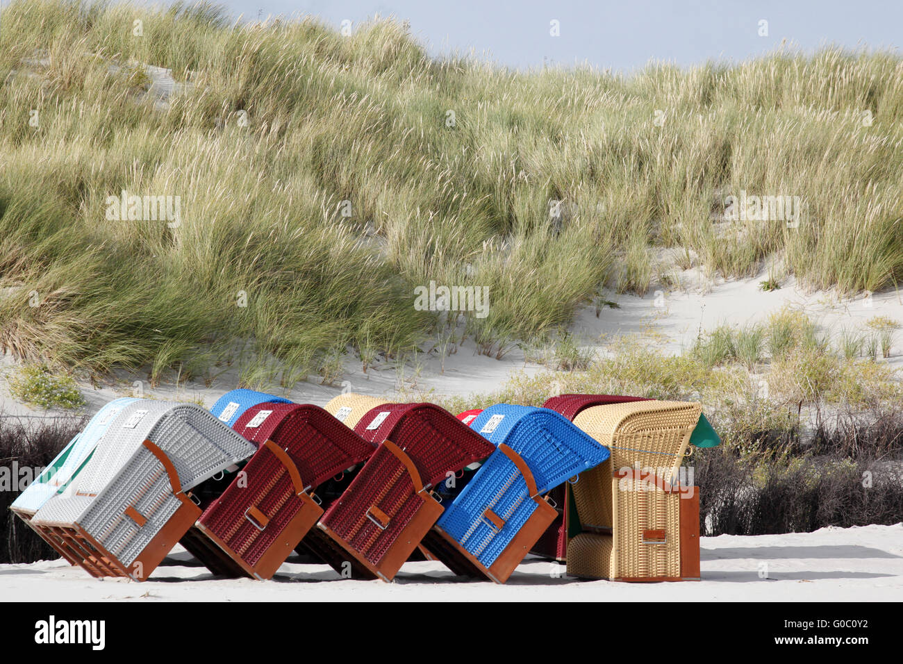 Colourful roofed wicker beach chairs Stock Photo Alamy
