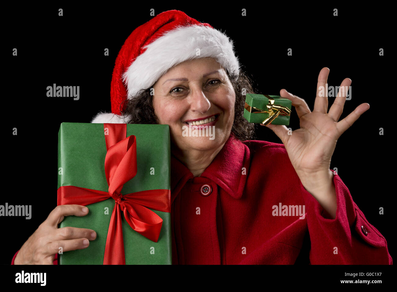 Smiling Old Woman Offering a Small and a Big Gift Stock Photo