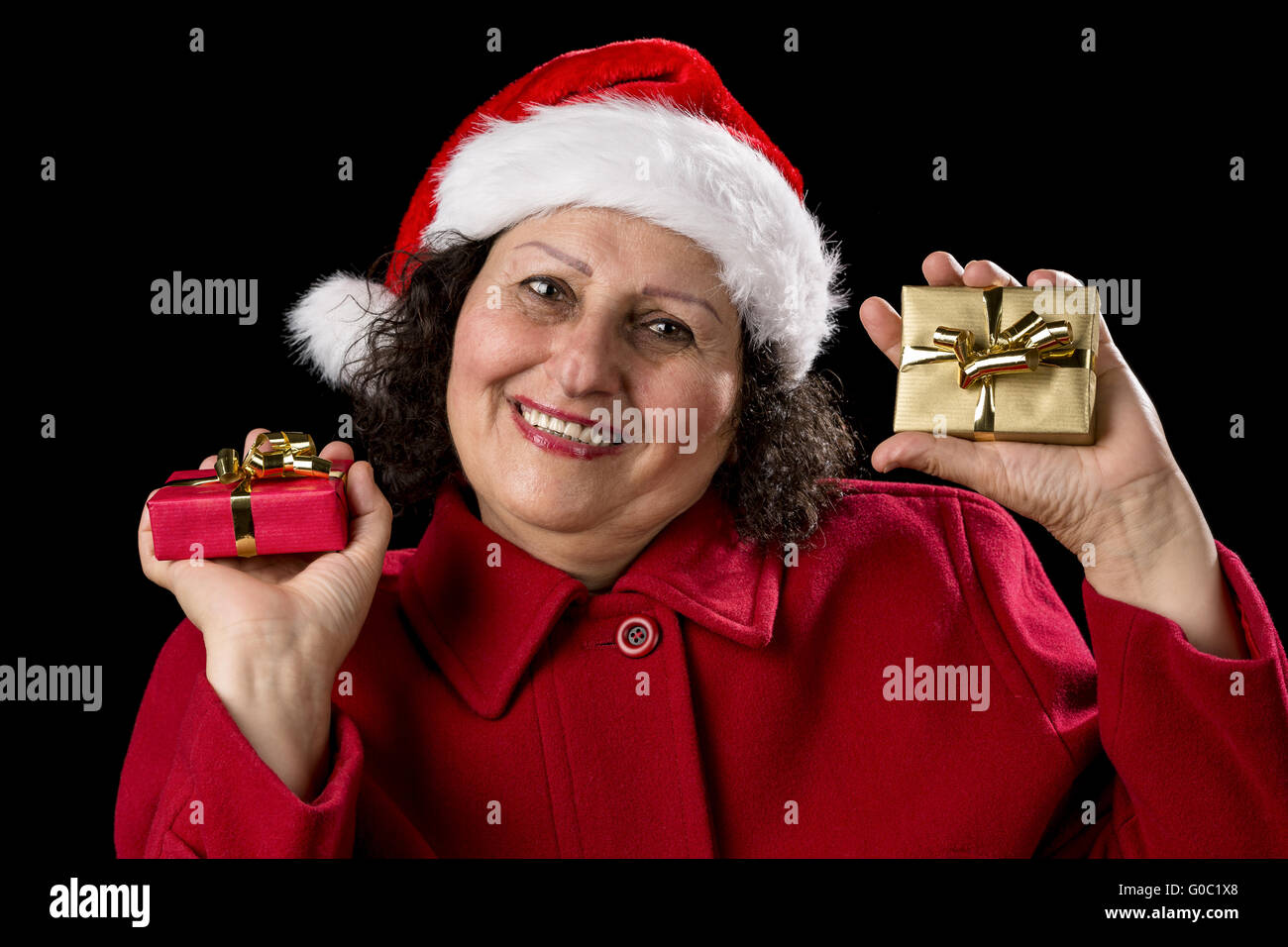 Elderly Lady with Wrapped Red and Golden Presents Stock Photo