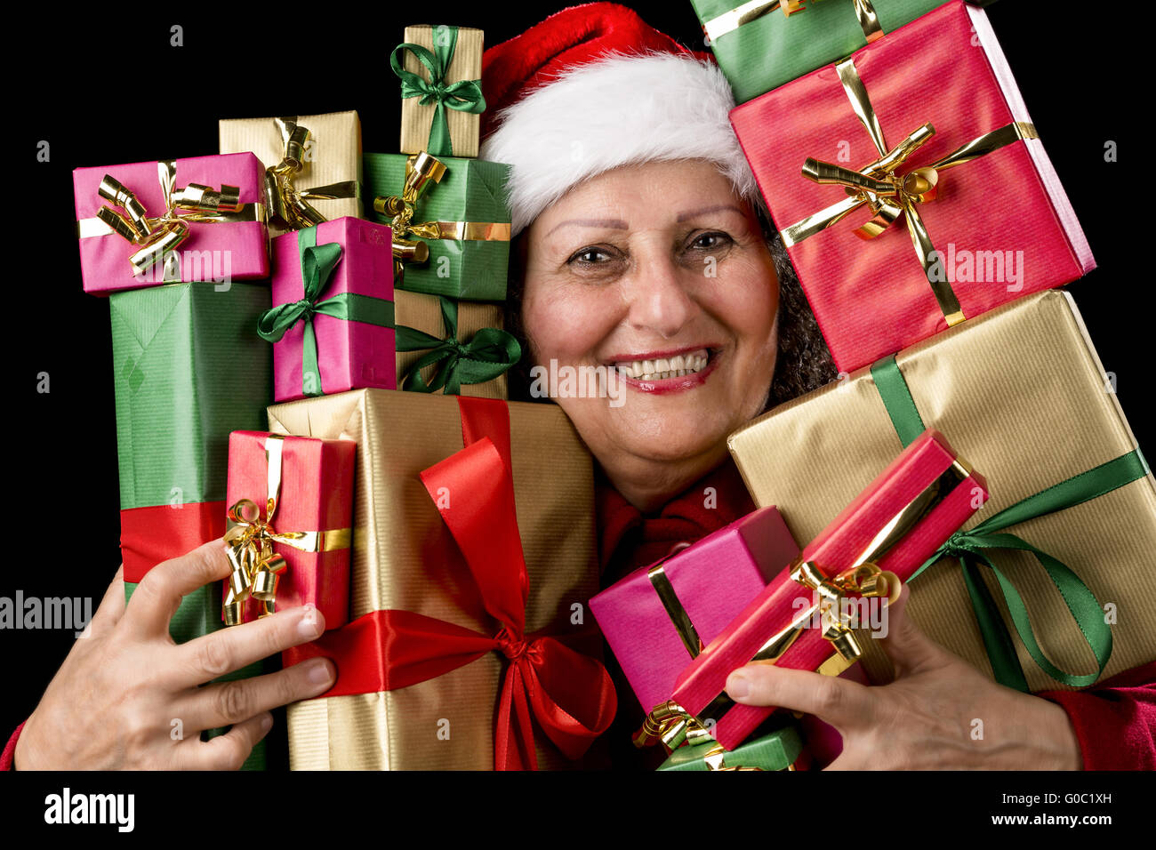 Delighted Aged Woman Embosoming Wrapped Presents Stock Photo