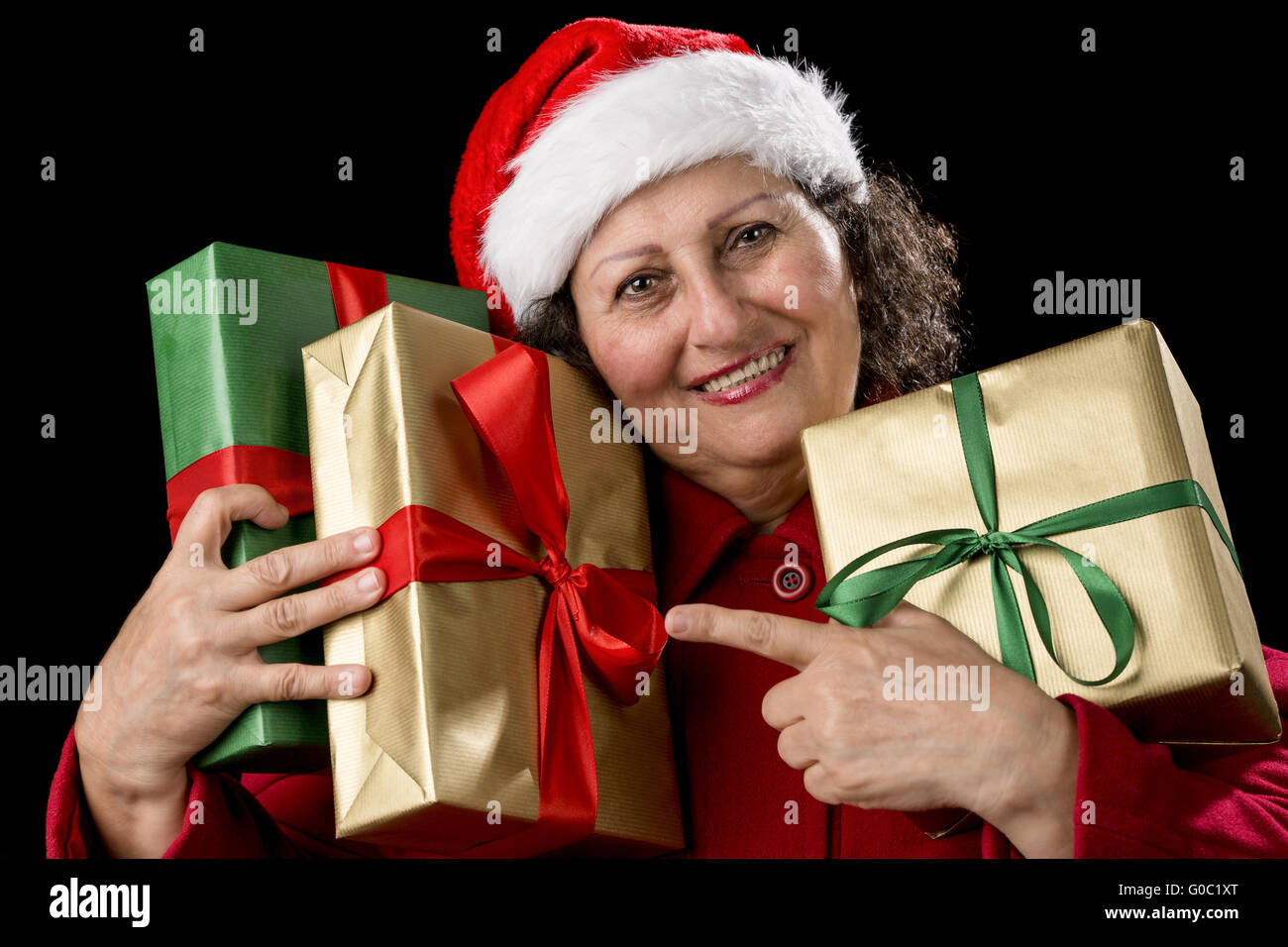 Elderly Woman with Three Wrapped Christmas Gifts Stock Photo