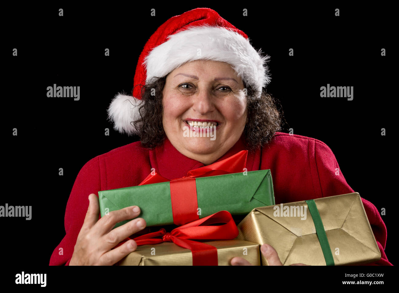 Delighted Elderly Woman Hugging Three Wrapped Gift Stock Photo