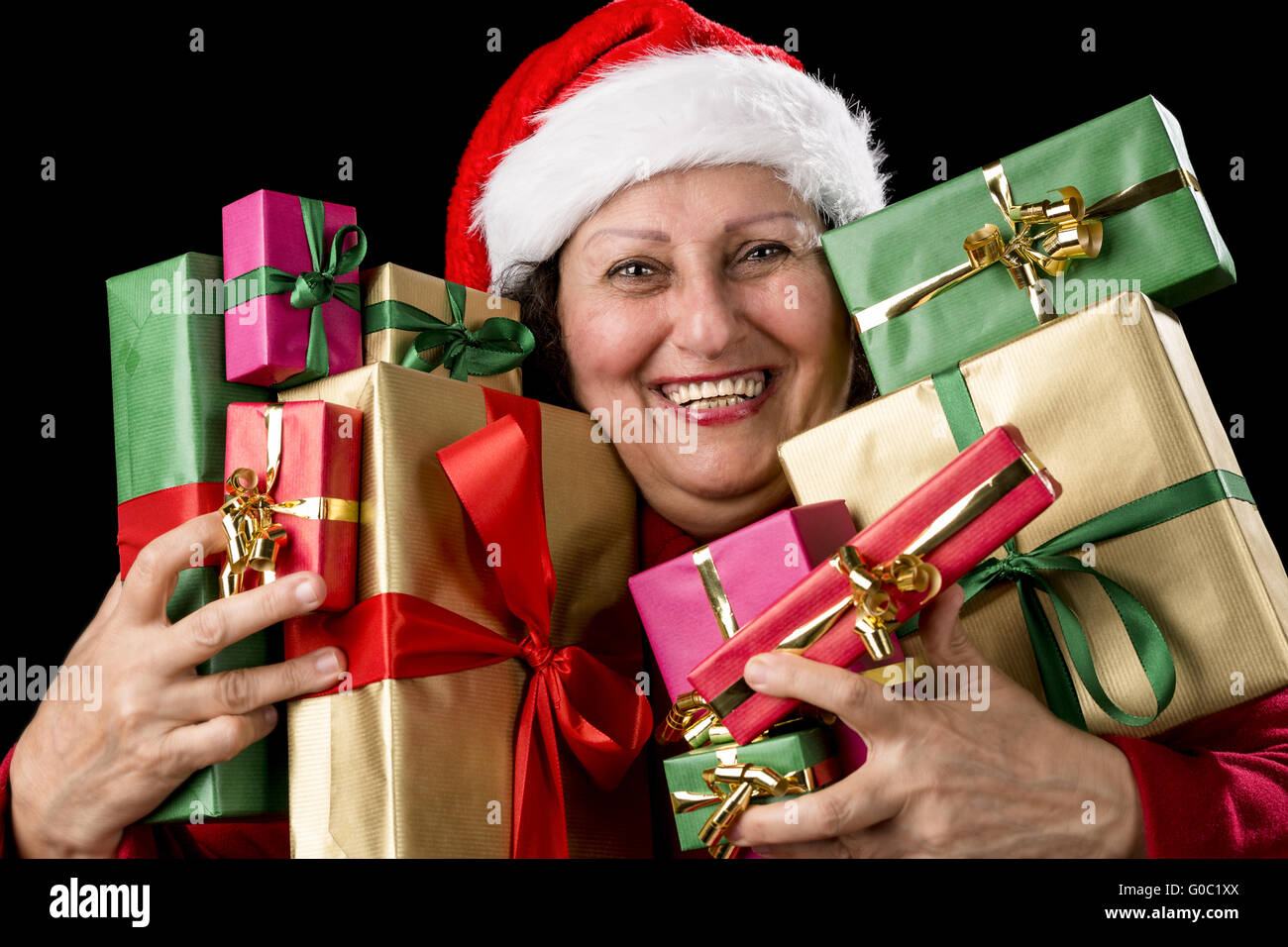Cheerful Aged Woman Embracing Wrapped Presents Stock Photo