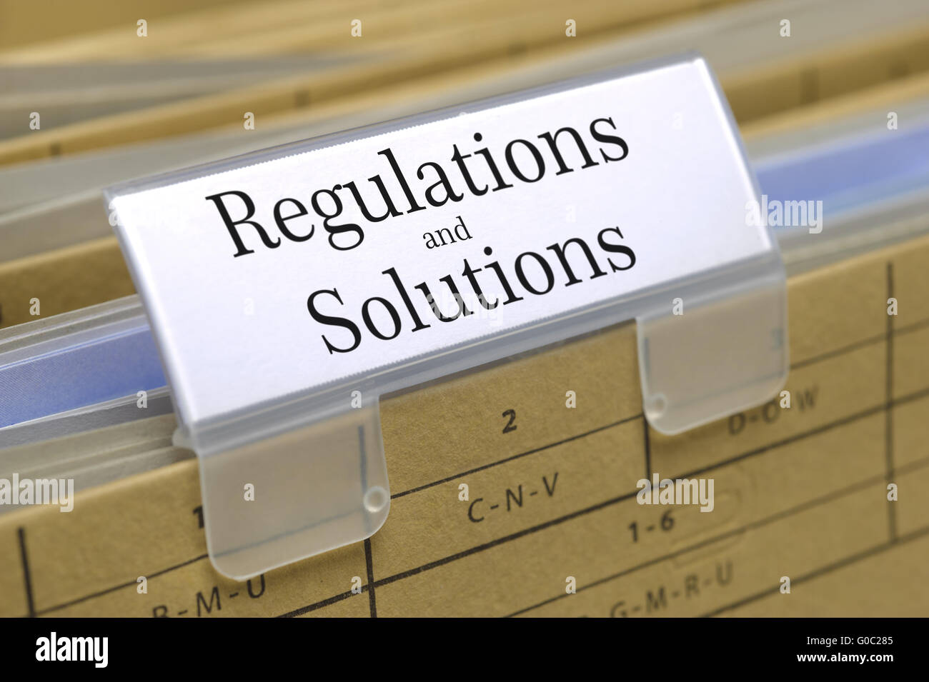 regulations and solutions marked on file folder Stock Photo