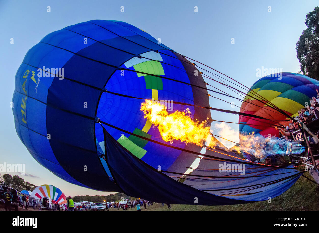 Fire heats the air inside a hot air balloon at balloon festival Stock