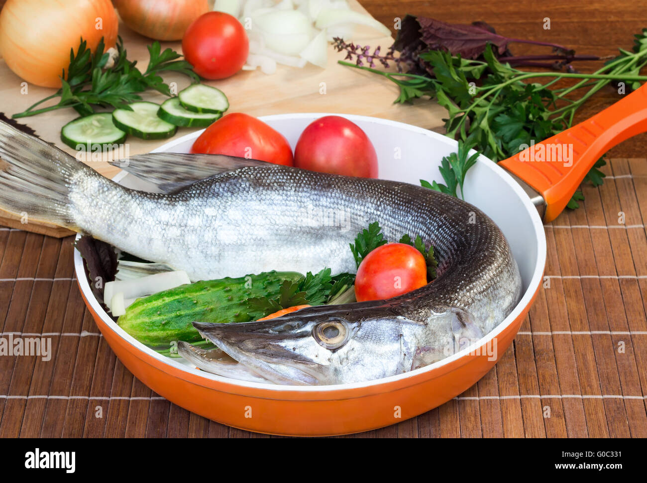 Fish and components for her preparation: vegetable Stock Photo