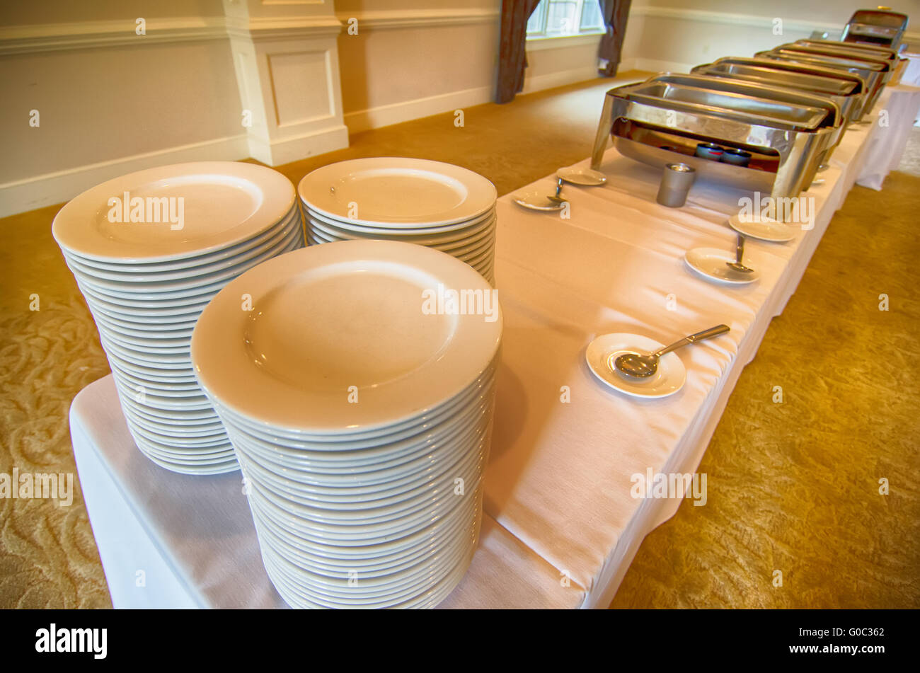 Chafing Dish and glass plates  at buffet Stock Photo