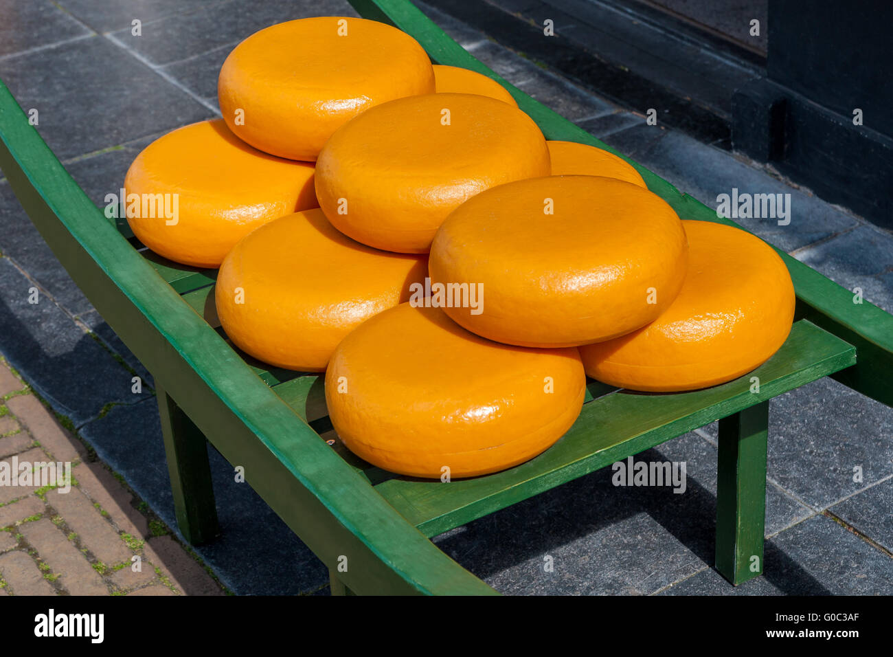 typical dutch load carrying big cheese wheels Stock Photo