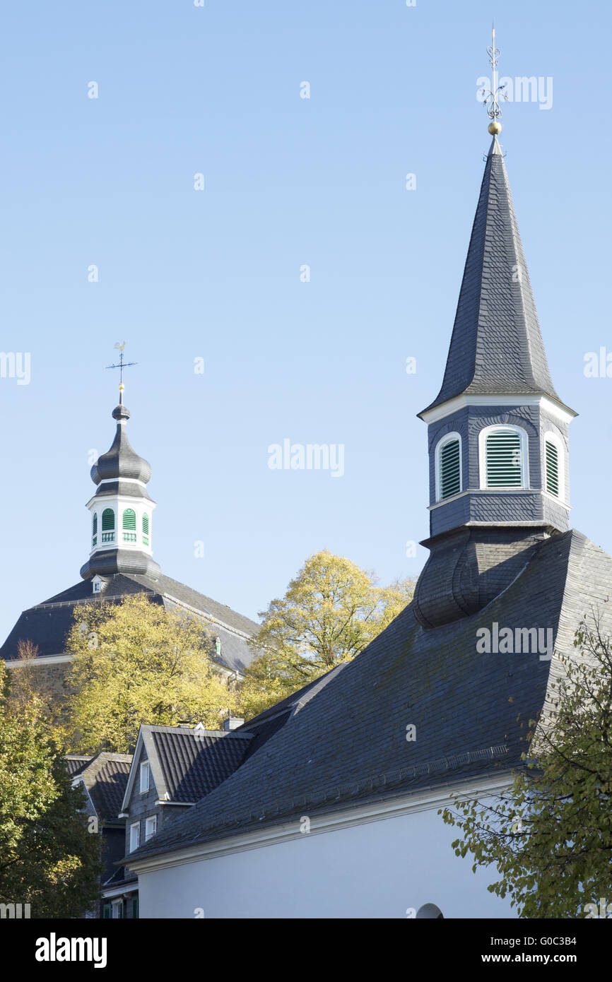 Evangelic and catholic church in Solingen-Graefrat Stock Photo