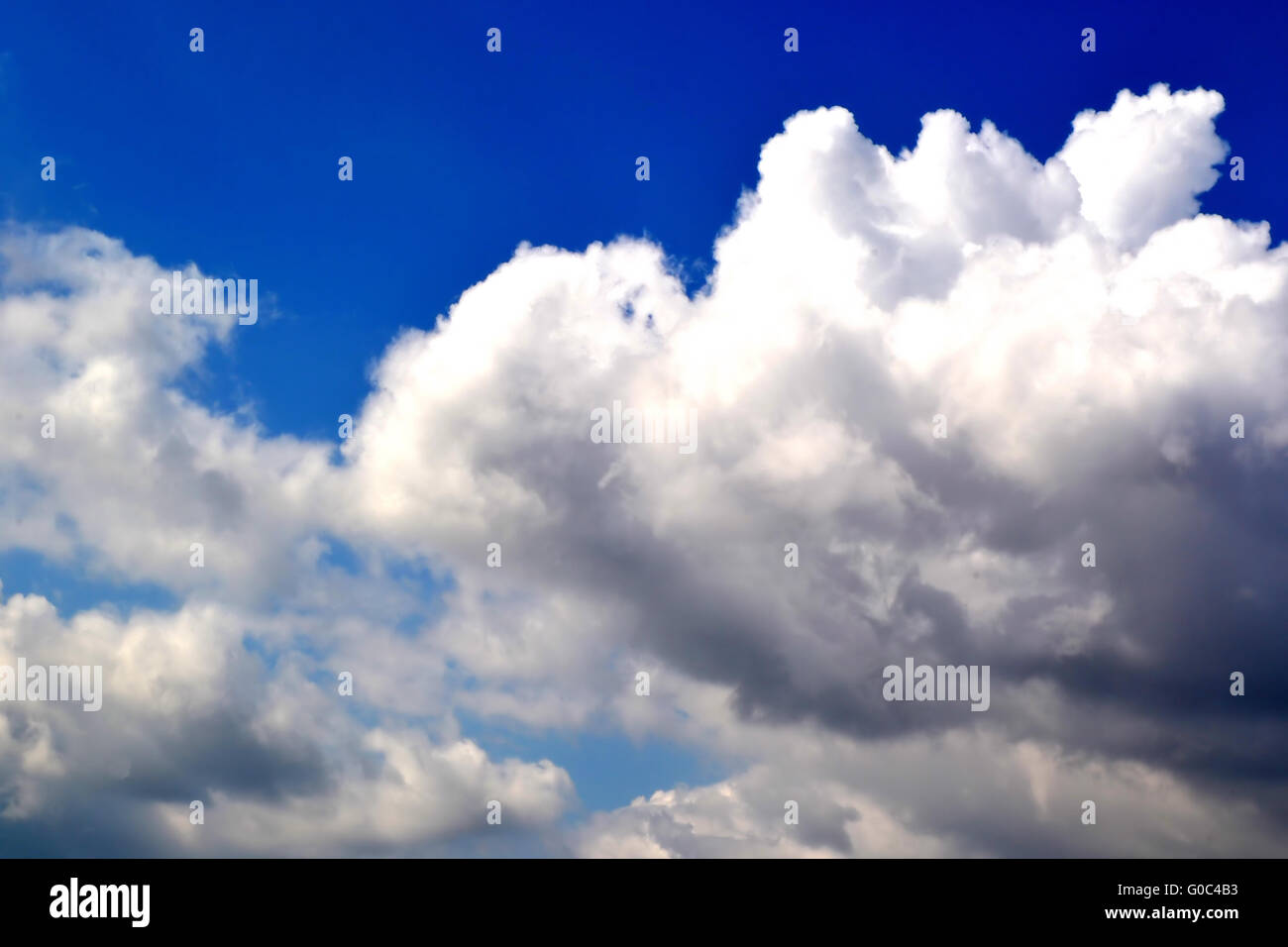Fluffy white clouds hovering hi-res stock photography and images - Alamy