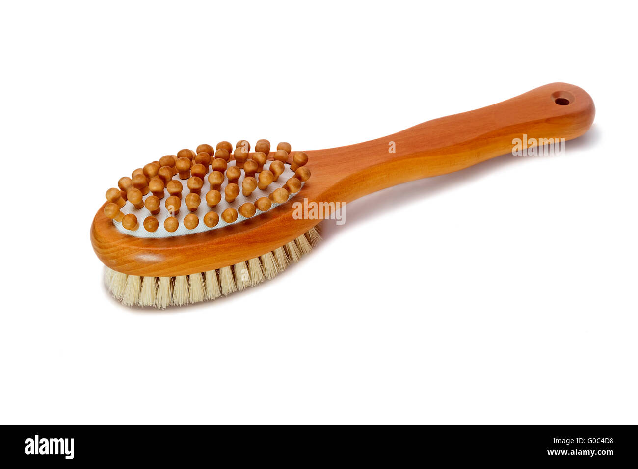 Brush for body massage on a white background. Stock Photo