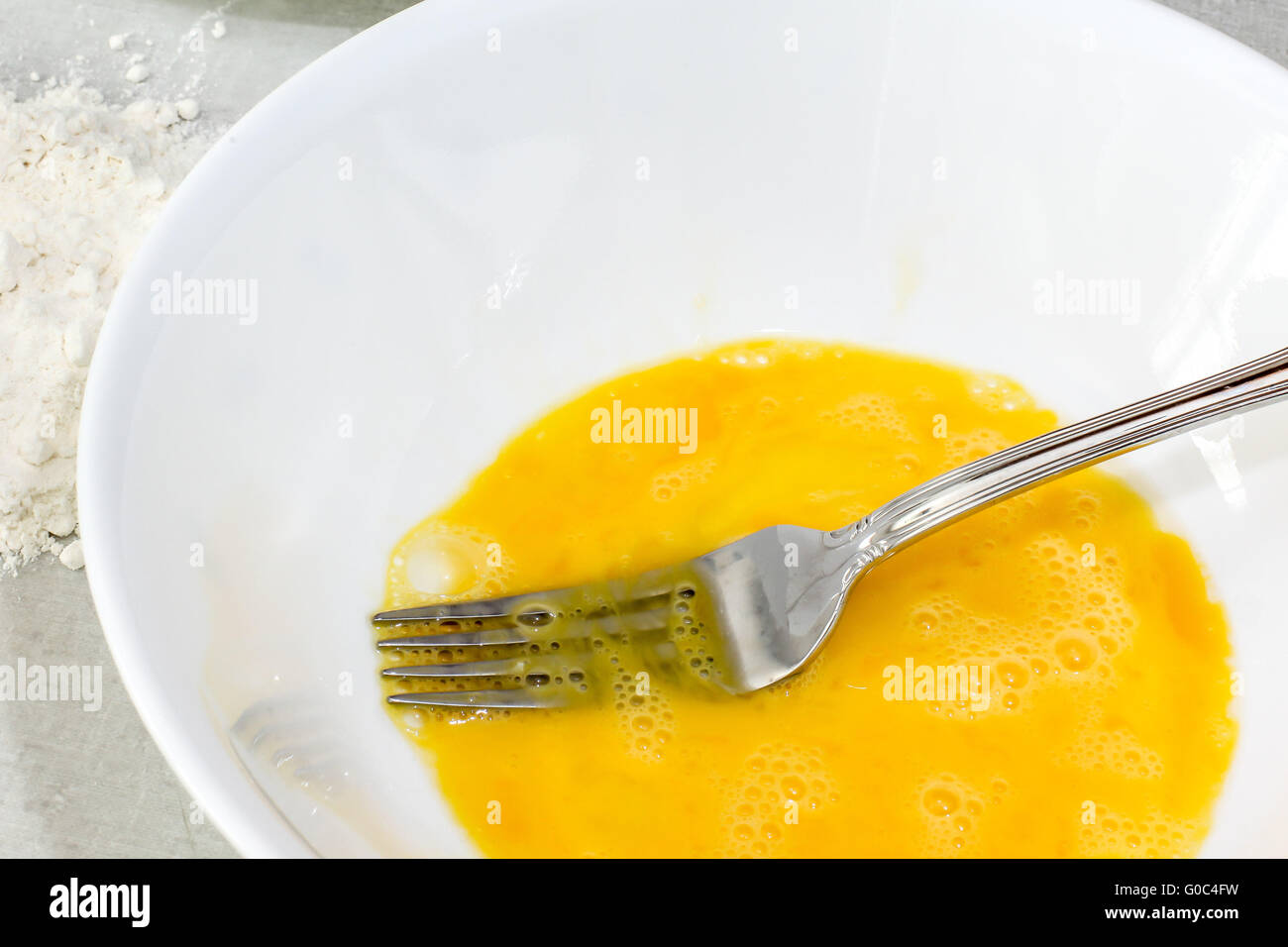 Mixe  egg with fork Stock Photo