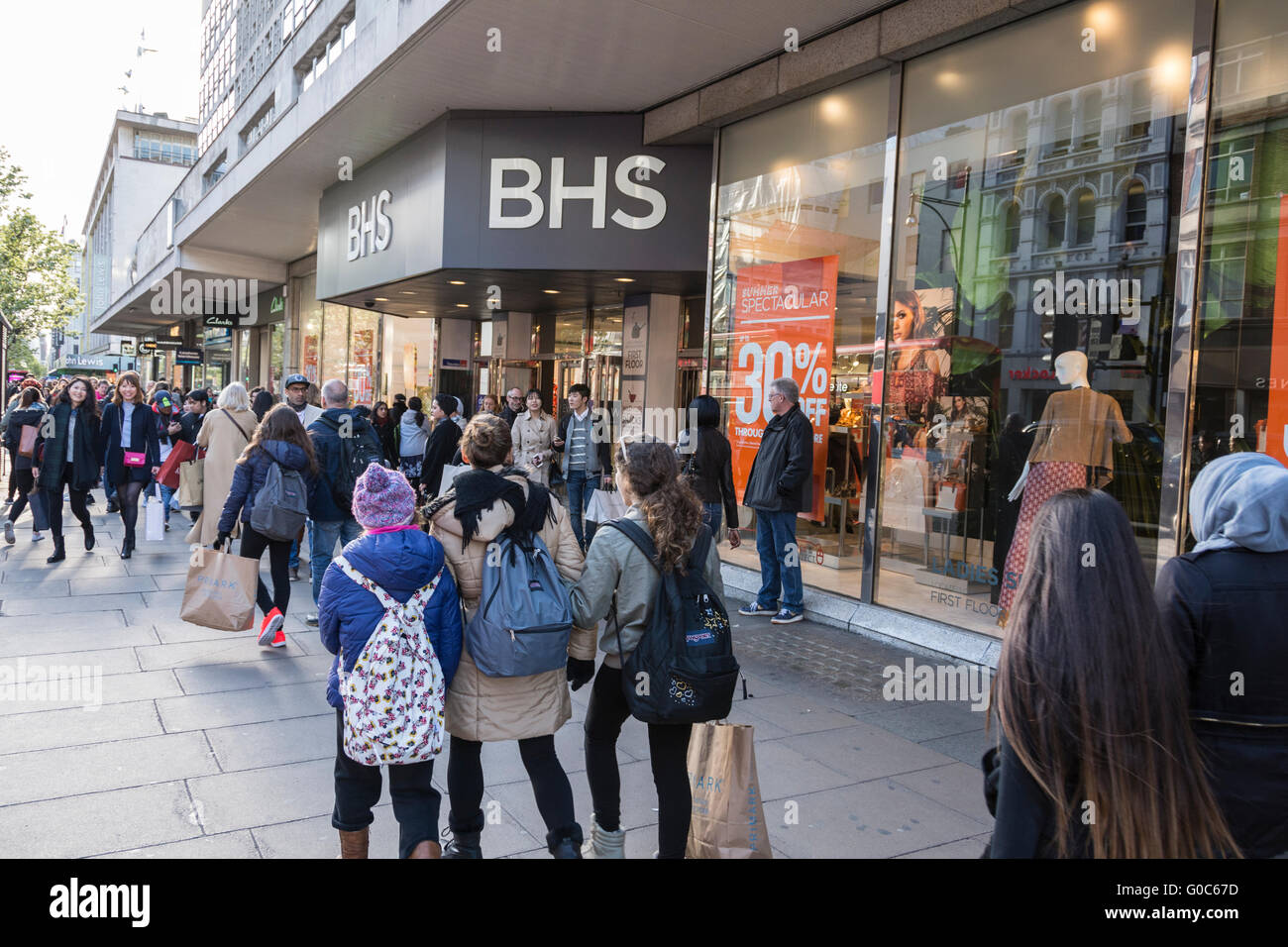 Shoppers pass in front of the former flagship BHS store on London's Oxford Street. Stock Photo
